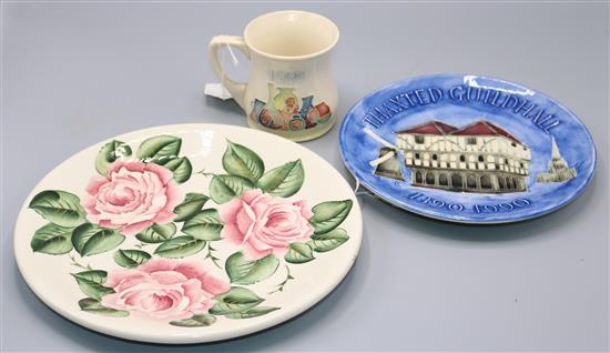 Moorcroft Wemyss style plate, a Thaxted Guildhall plate and a 1989 Museum Mug